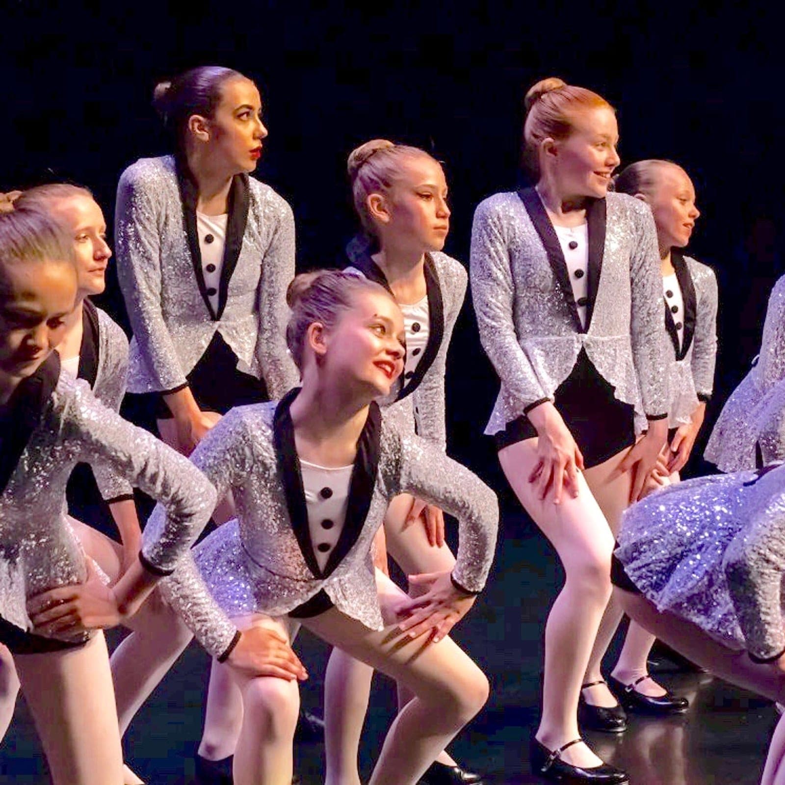 Jazz dancers in sequin jackets performing on stage in Saltash and Plymouth